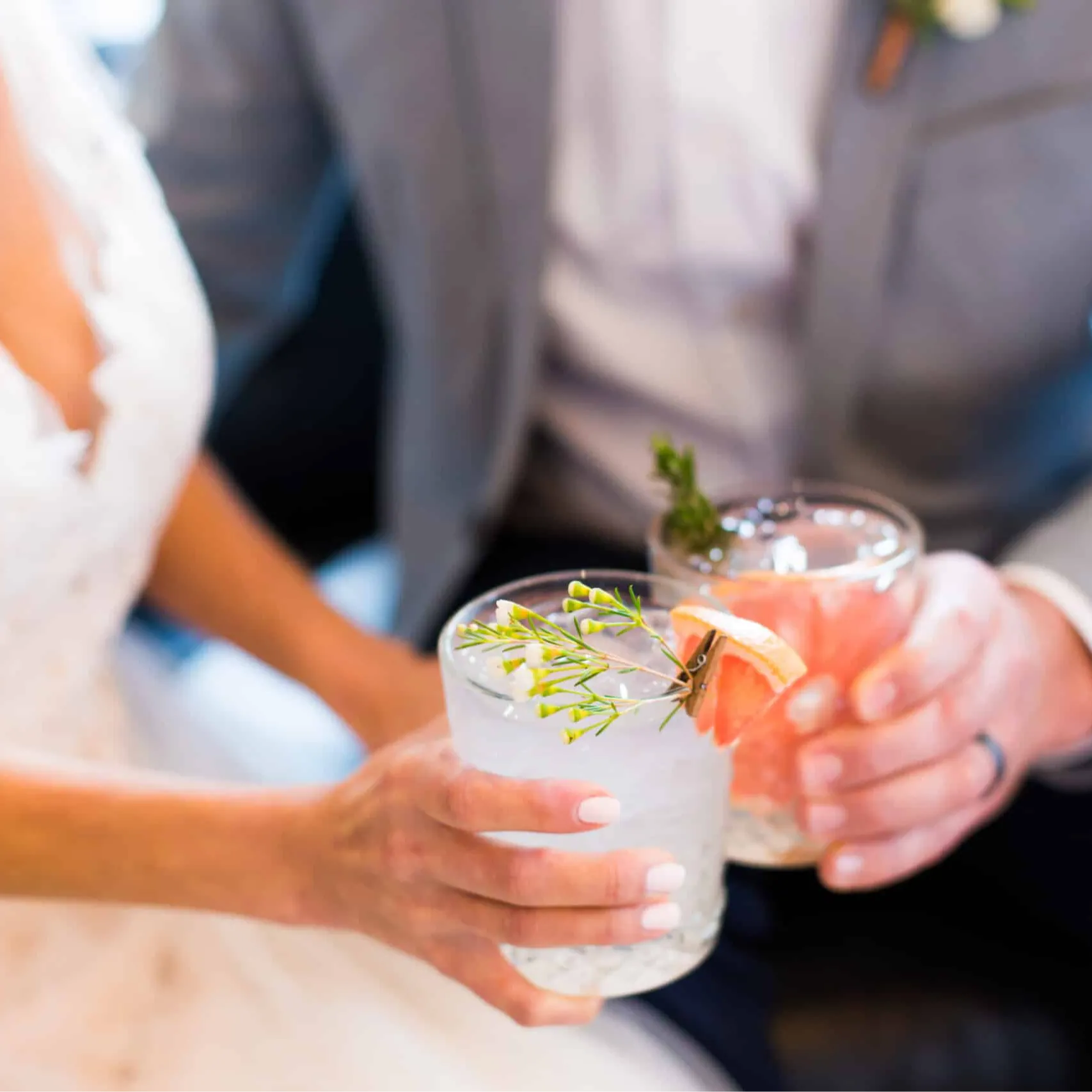 A bride and groom celebrate their recent vows with a toast
