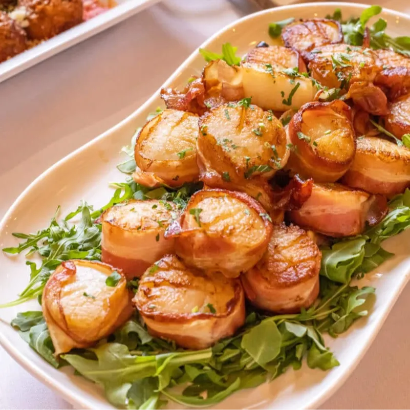 Scallops wrapped in bacon - a favorite for guests